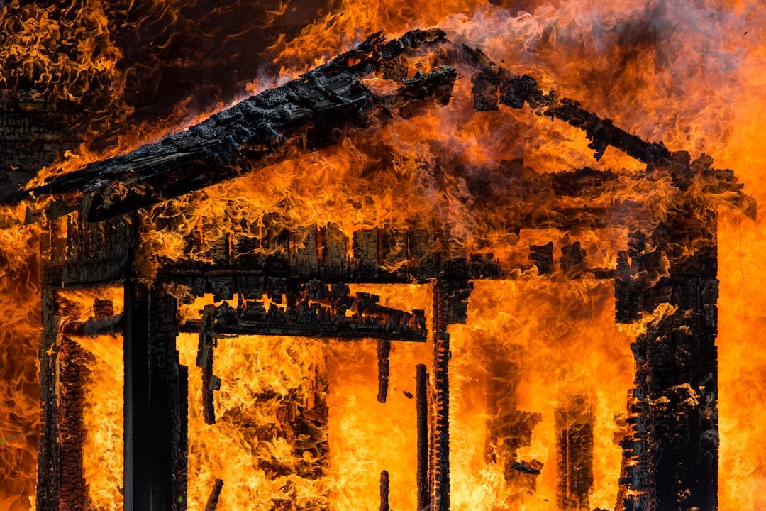 mother carrying child from burning house