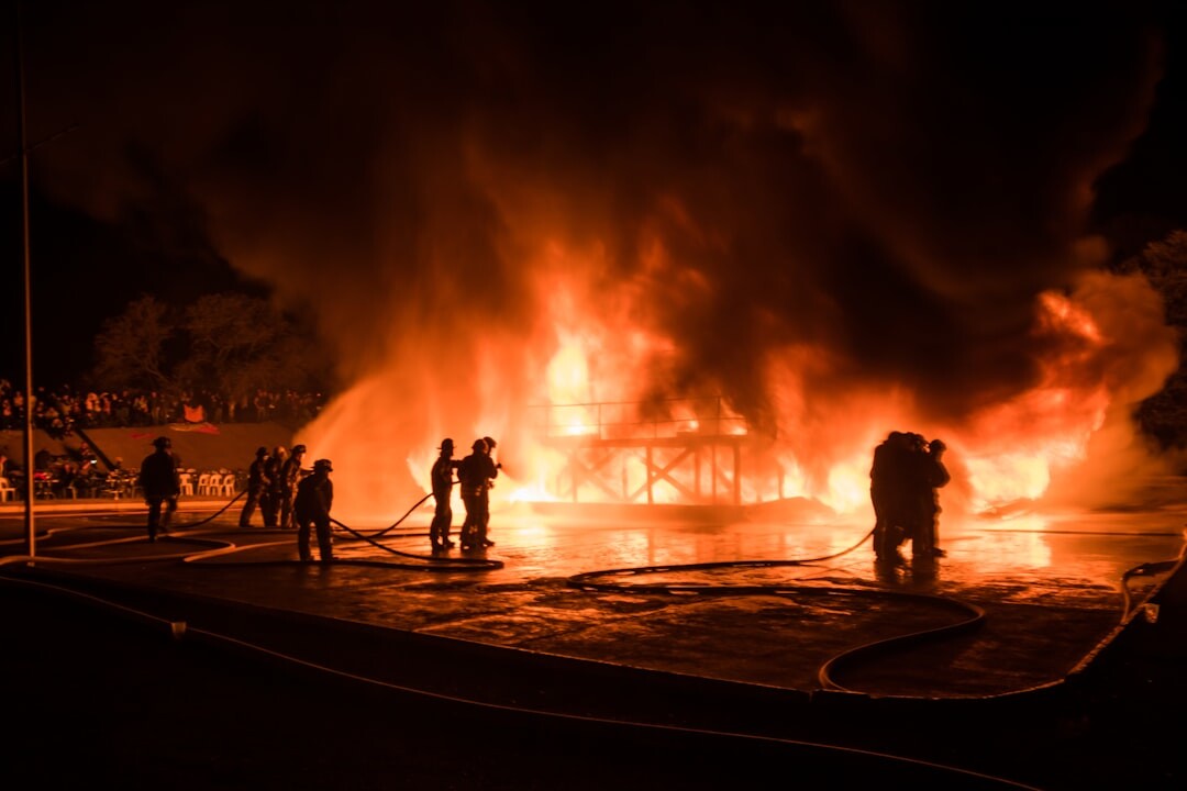 firefighters at burning house