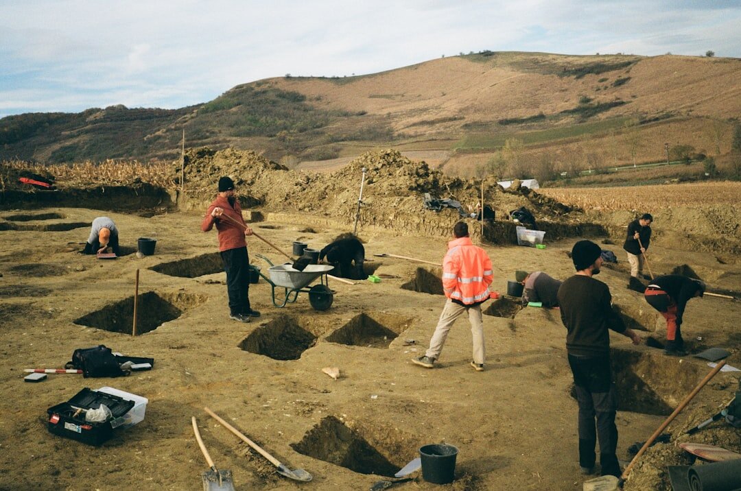 archaeologists digging site