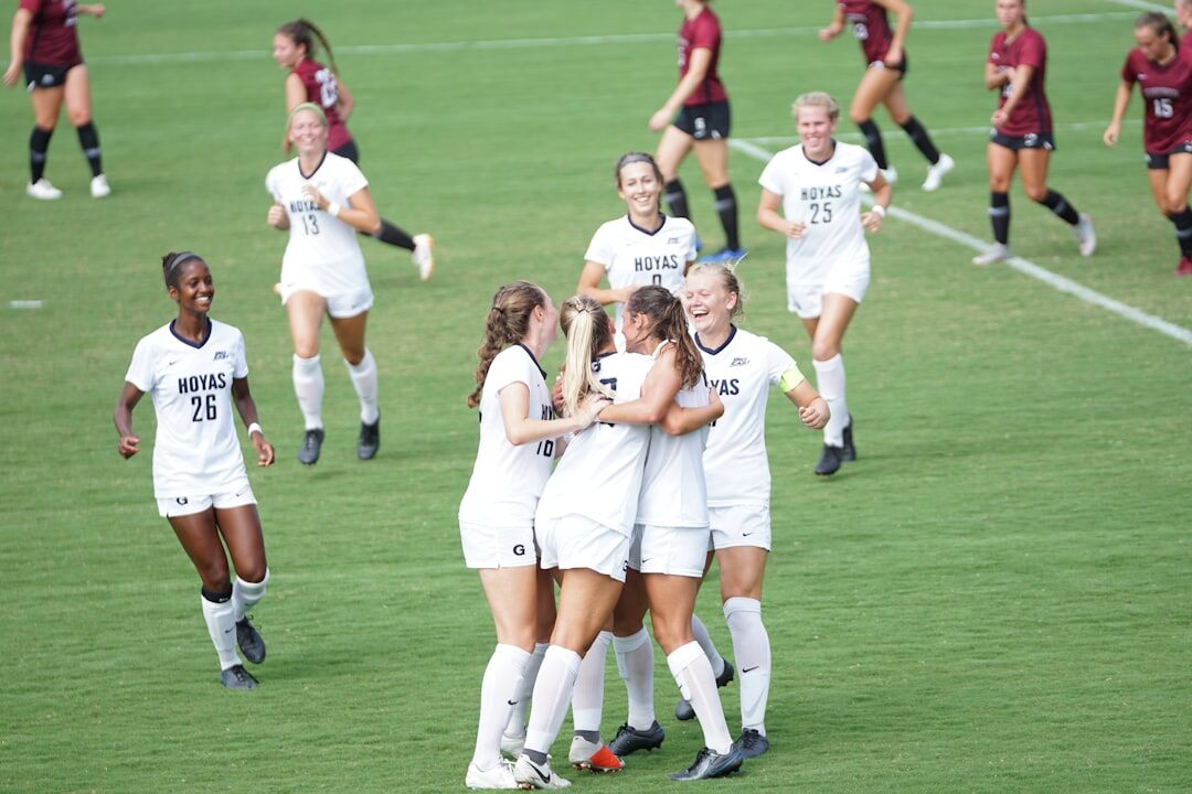 soccer players celebrating victory